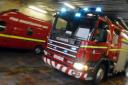 Resident rushed to hospital after a flat fire in Renfrew