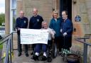 Gryffe Valley Rotary Club, represented by David Fairbairn and Hugh Kerr, presented a cheque for £500 to Quarriers Fountainview residents Andrew Spence and Vincent Paton (far right) and project manager Lorna Gordon