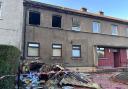 Man rushed to hospital and residents evacuated after flat blaze
