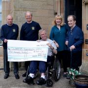 Gryffe Valley Rotary Club, represented by David Fairbairn and Hugh Kerr, presented a cheque for £500 to Quarriers Fountainview residents Andrew Spence and Vincent Paton (far right) and project manager Lorna Gordon