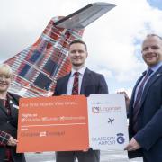 Cabin crew Amy Russo and Loganair’s chief commercial officer Luke Lovegrove, with Ronald Leitch, operations director at Glasgow Airport