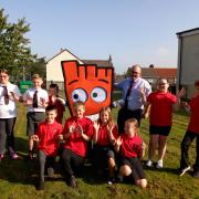 Pupils at St Peter’s Primary with Councillor Stephen Burns and Strider, Living Streets’ mascot, as they launch a new year of WOW