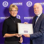 Heather Scanlan being awarded the Erskine Long Service Award from Stuart Aitkenhead
