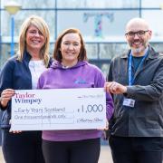 Lynsey Cooper, Taylor Wimpey West Scotland, along with Gary Lindsay and Sarah Jane McKillop from Early Years Scotland at the Tannahill Centre, in Paisley