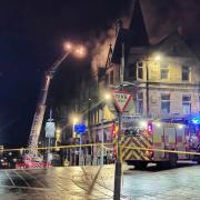 999 crews battle blaze at building close to busy high street
