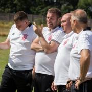 McKim (second from left) casting an eye over Burgh’s many trialists along with assistant Davy Hill (second from right) and his coaching staff