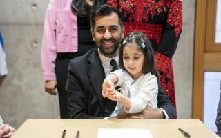 Humza Yousaf and daughter Amal, 3 as he signs his nomination form for first minister