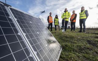(left to right) Toby Smith (Zestec), Helena Anderson (Ikigai), Ronald Leitch, Simon Booth (Zestec) and Roberto Castiglioni (Ikigai) at the solar farm next to Glasgow Airport
