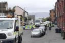 Police sealed off Macdowall Street, in Johnstone, after the attack