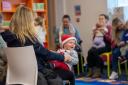 Parents, carers and children at a Bookbug session in Johnstone Library