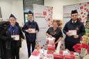 Youngsters from 3rd Johnstone Boys' Brigade Company with Donna Armstrong, of Poppyscotland, at the town's Morrisons store