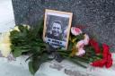 Flowers next to a portrait of Russian opposition leader Alexei Navalny (AP)