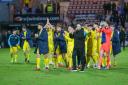 Morton players applaud fans after beating Dunfermline 5-0 in February