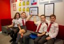 Pupils at Bargarran Primary show off the award won by the school for promoting digital inclusion