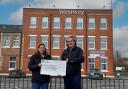 Gregor King presents Crystal Clayton with the £10,000 cheque