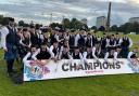 Members of Renfrewshire Schools Pipe Band celebrate their success at the World Pipe Band Championships