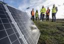 (left to right) Toby Smith (Zestec), Helena Anderson (Ikigai), Ronald Leitch, Simon Booth (Zestec) and Roberto Castiglioni (Ikigai) at the solar farm next to Glasgow Airport