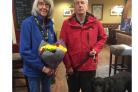 Anne Ferguson was presented with flowers by fellow fundraiser Derek Parrot, with guide dog Striker