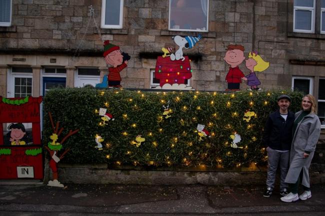 Jamie-Max Caldwell and Paige Morris with the Peanuts display at their Hagg Crescent home