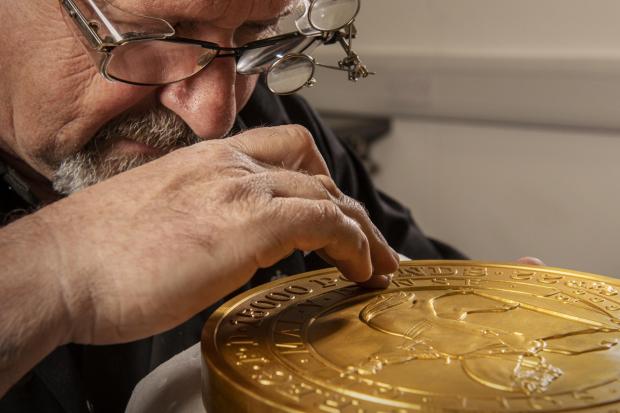 The Gazette: Master craftsman Steve Dyer works on the 15 kilo gold coin by hand. Credit: The Royal Mint