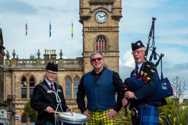 Chieftain Shaun Moore (centre), with Mark McKendrick, of Renfrewshire Schools Pipe Band, and Alan McGeogh, of Johnstone Pipe Band