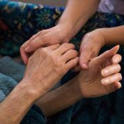 Care home visits are to resume from next month