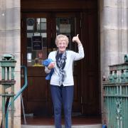 Meg Main outside Renfrew Victory Baths looking forward to the centenary exhibition