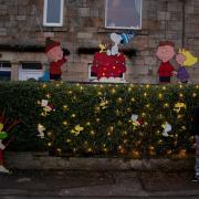 Jamie-Max Caldwell and Paige Morris with the Peanuts display at their Hagg Crescent home