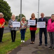 Residents at a previous protest against plans to erect the 5G mast