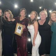 The LoveDog Grooming team with their award