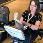 Linda Flynn, team supervisor at Paisley Central Library, preparing for her spin bike reading session