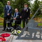 Norrie McDade, Craig McDermott and Bill McDowall at Erskine’s Falklands memorial sundial, titled ‘The Shadow of the Brave