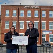Gregor King presents Crystal Clayton with the £10,000 cheque