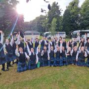 Renfrewshire Schools Pipe Band celebrate their victory at the Scottish Pipe Band Championships 2023