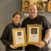James Carmichael and his wife Gemma with their two awards