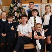 Kilbarchan primary school pupils, pictured from left - Rebecca McKenzie, Oliver Morrison, Rachel Byrne, Innes Stevenson (standing at back), Rory Shaw (white shirt and tie), Anna-Katerina Westbrook and Myla McNaughton (standing at right)