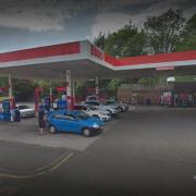Hunt for men who racially abused petrol station worker